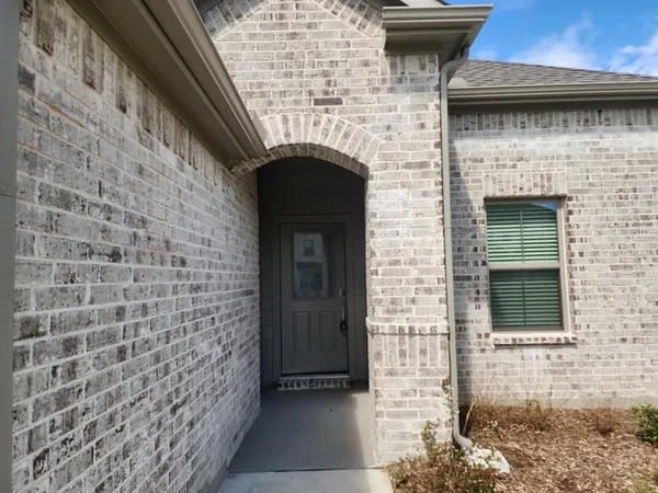 a front view of a house with an entrance