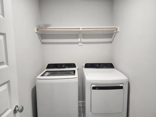 a utility room with dryer and washer