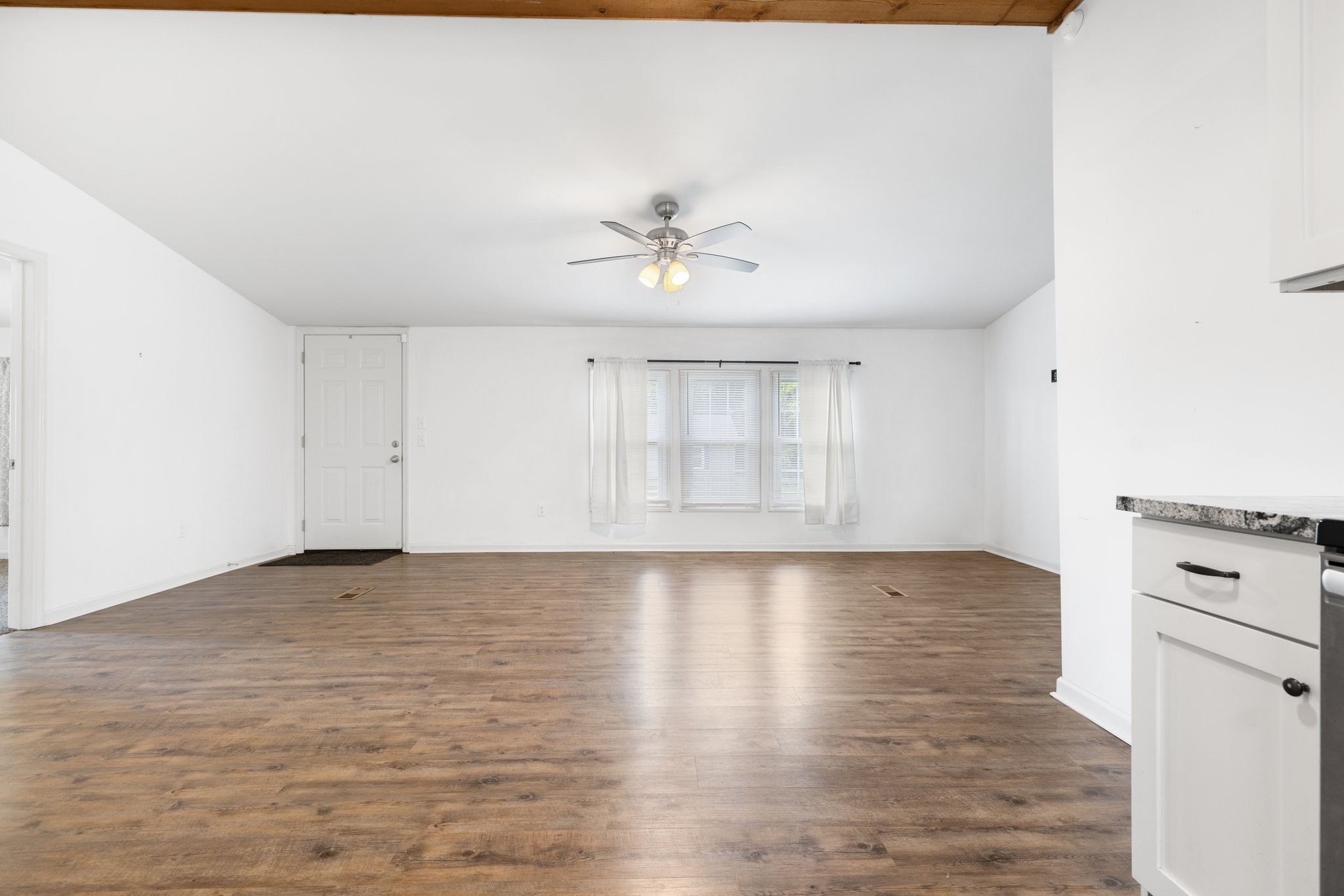 404 Broadview Street Chapel Hill, TN 37034 - Photo 8 of 21 a view of an empty room with window and wooden floor