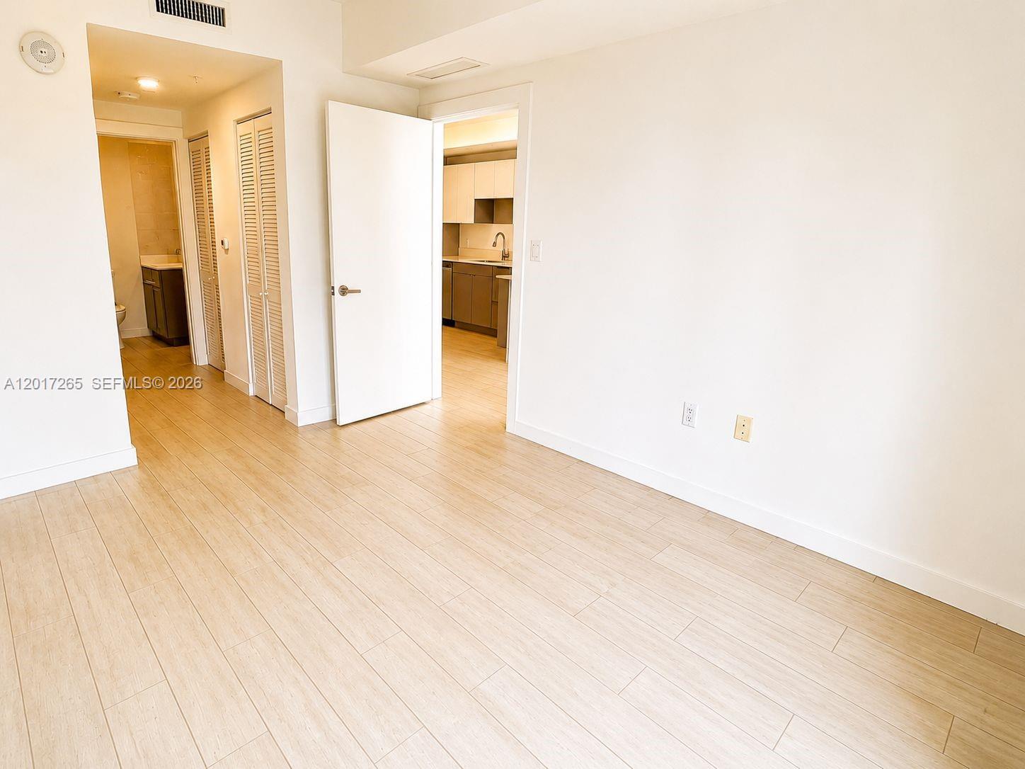 321 Northeast 26th Street, Unit 515 Miami, FL 33137 - Photo 4 of 7 a view of a hallway with wooden floor
