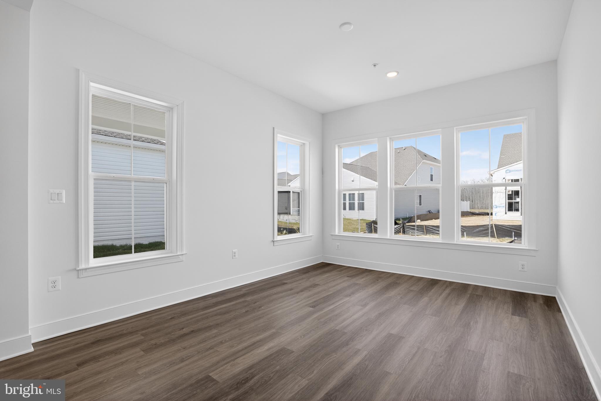 539 Warbler Way Chester, MD 21619 - Photo 14 of 51 an empty room with wooden floor and windows