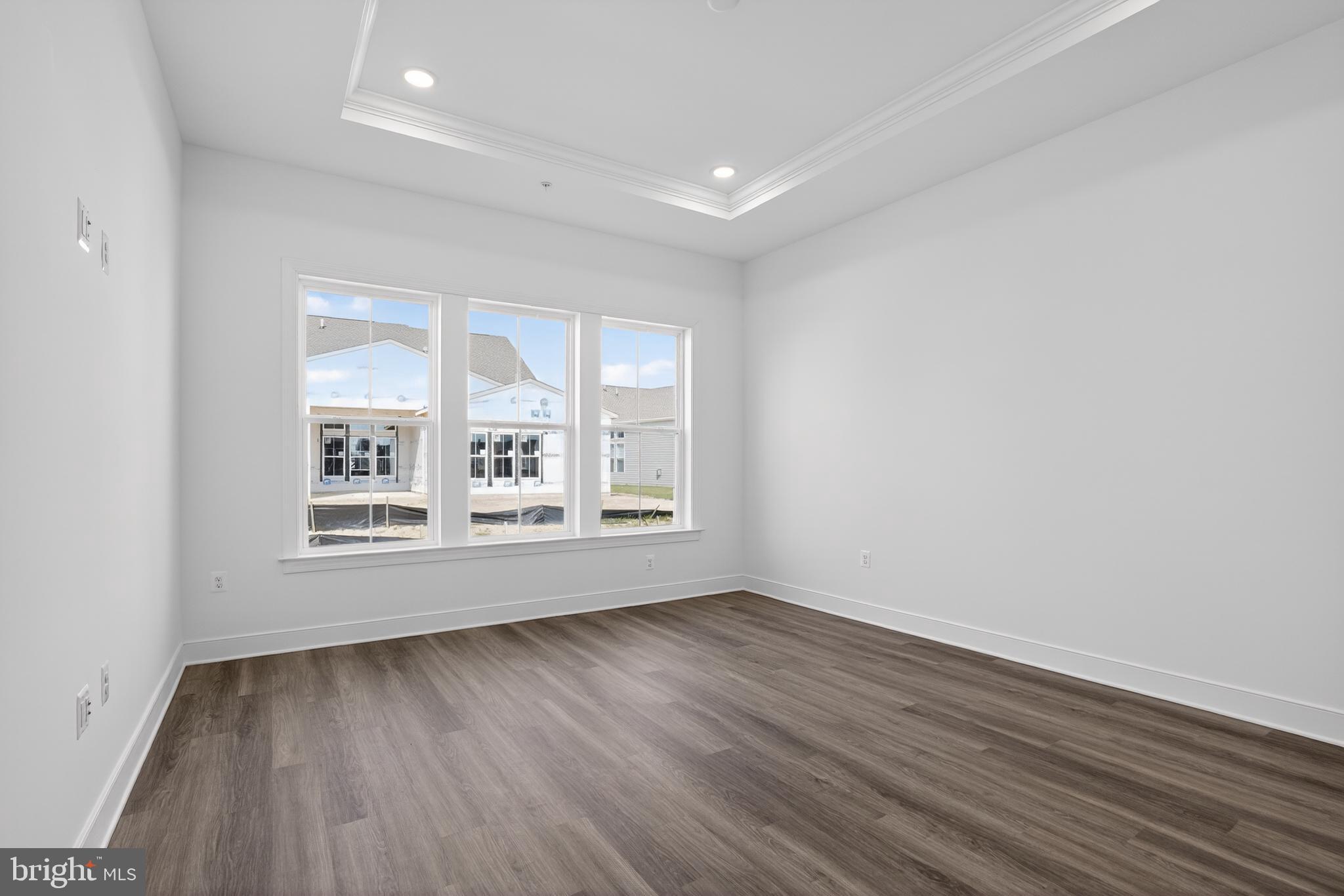 539 Warbler Way Chester, MD 21619 - Photo 18 of 51 an empty room with wooden floor and windows