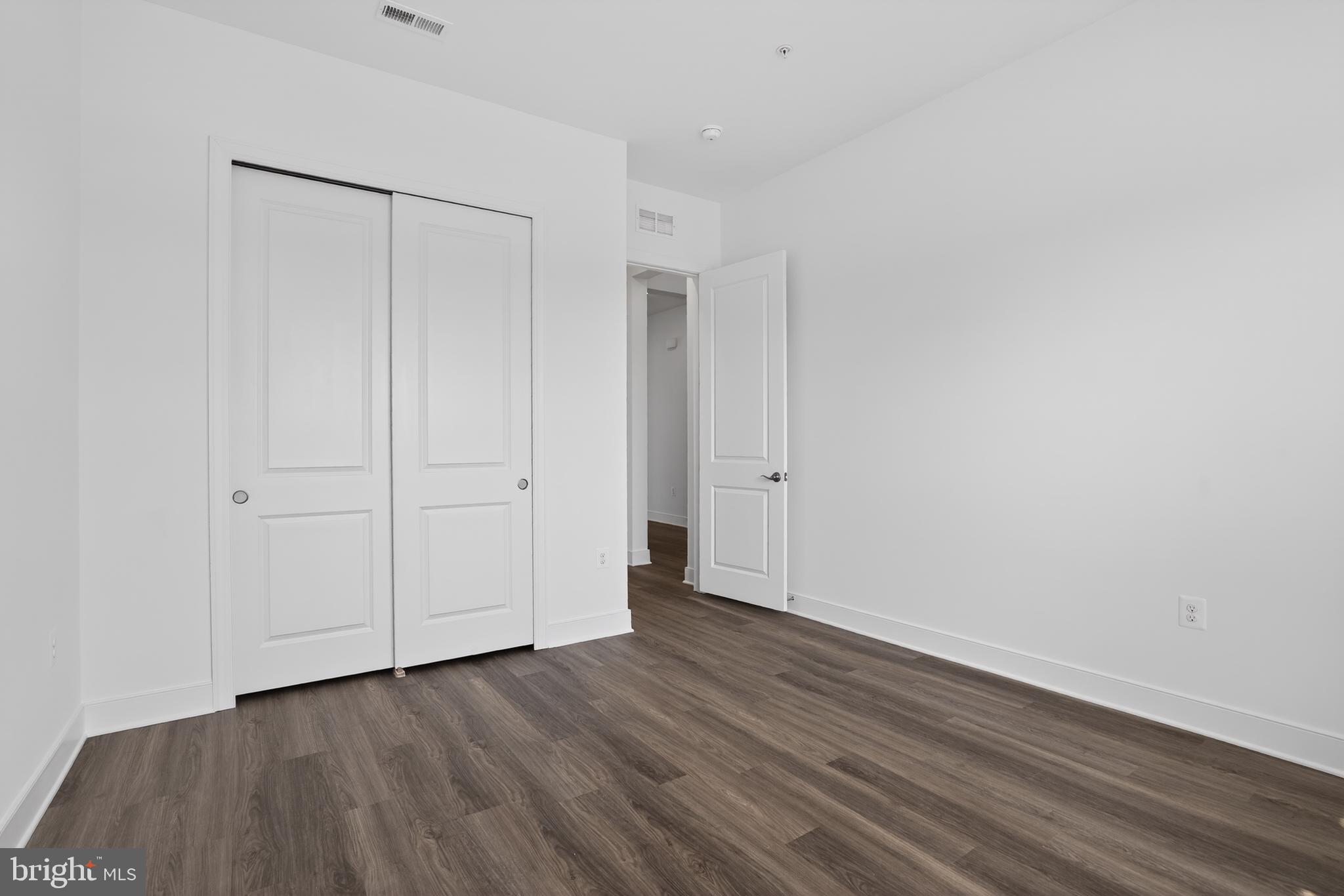 539 Warbler Way Chester, MD 21619 - Photo 21 of 51 a view of an empty room with wooden floor