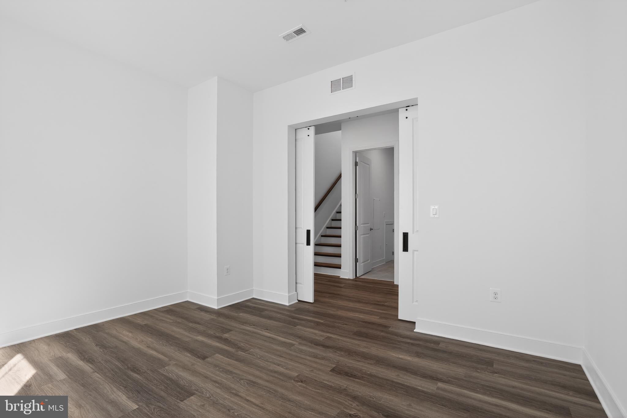 539 Warbler Way Chester, MD 21619 - Photo 3 of 51 a view of a hallway with wooden floor and entryway