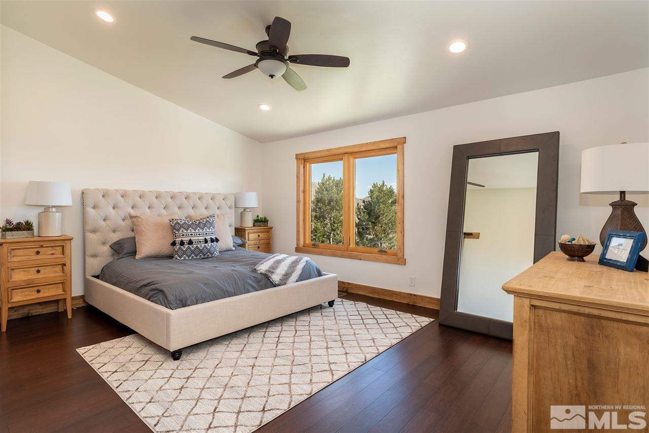 15000 North Red Rock Road Reno, NV 89508 - Photo 12 of 25 a bedroom with a bed and wooden floor