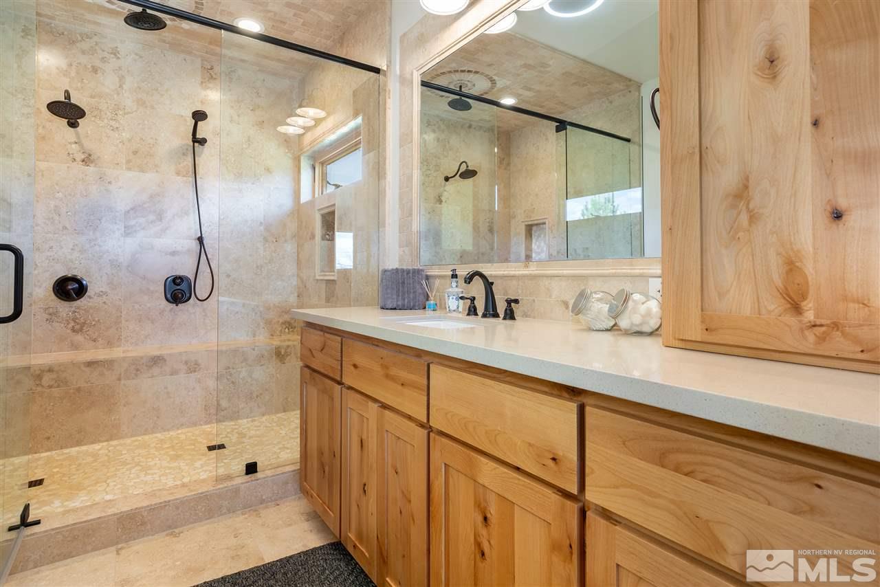 15000 North Red Rock Road Reno, NV 89508 - Photo 14 of 25 a bathroom with a shower sink and mirror