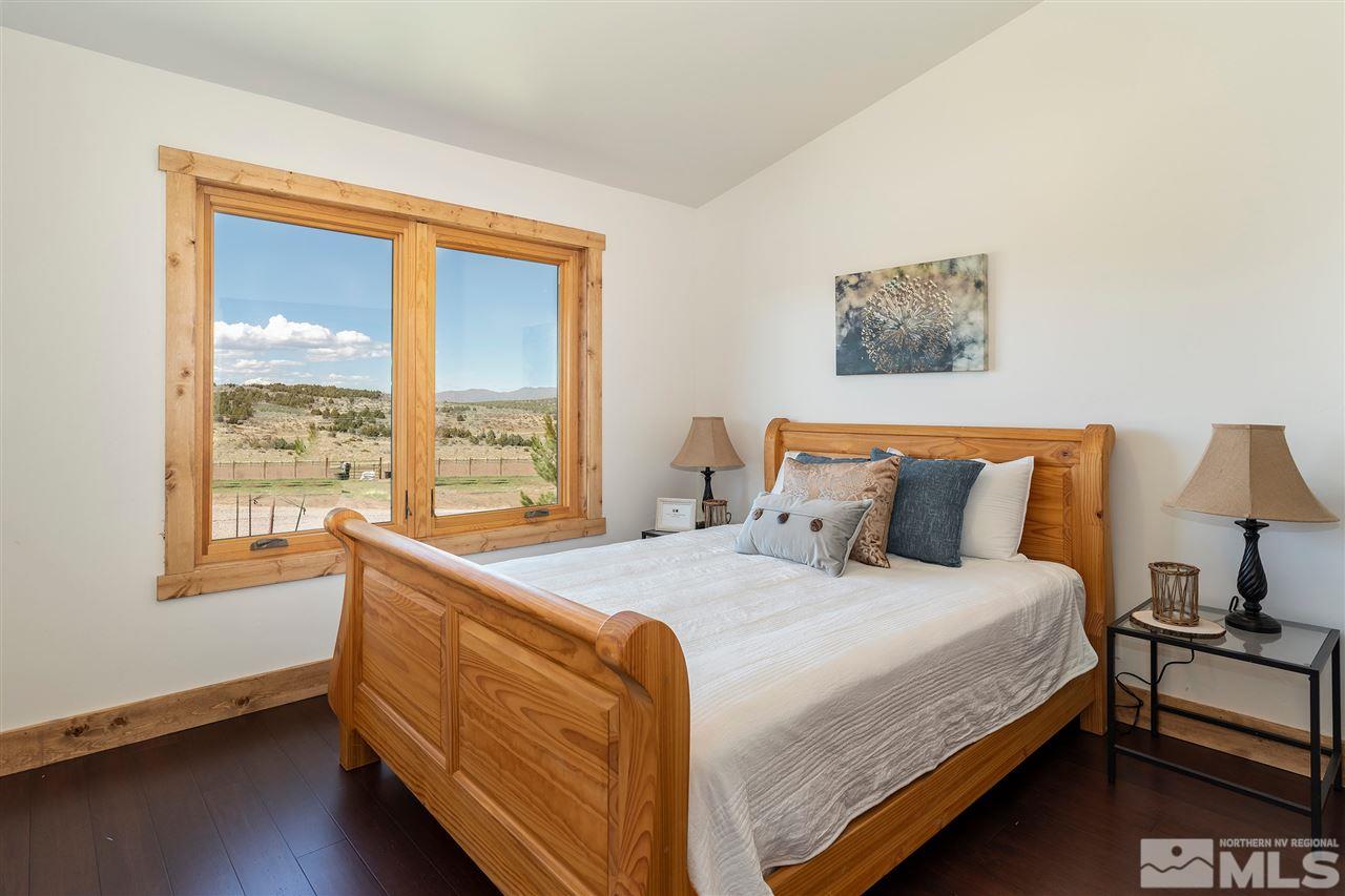 15000 North Red Rock Road Reno, NV 89508 - Photo 18 of 25 a bed sitting in a bedroom next to a window