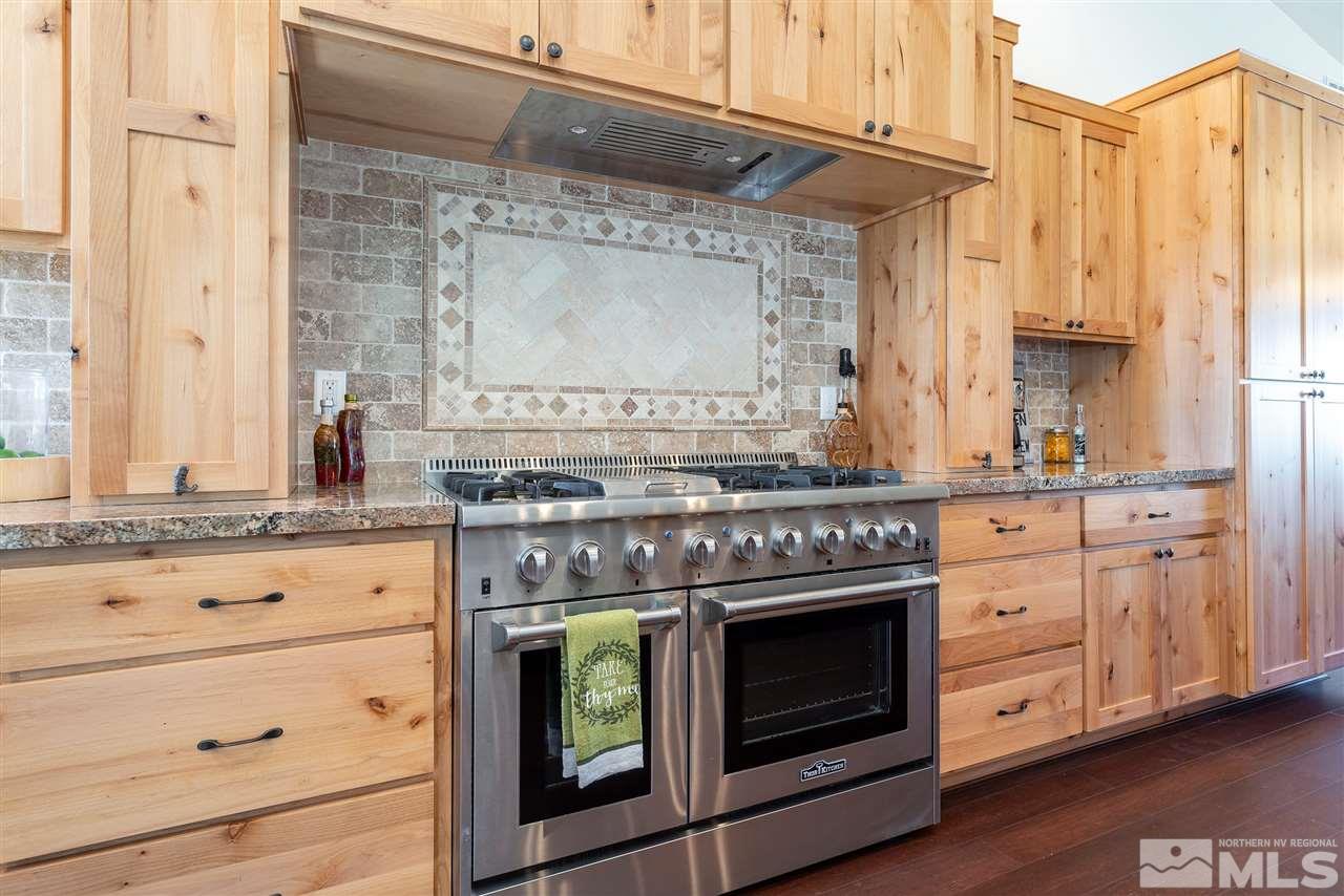 15000 North Red Rock Road Reno, NV 89508 - Photo 8 of 25 a stove top oven sitting inside of a kitchen