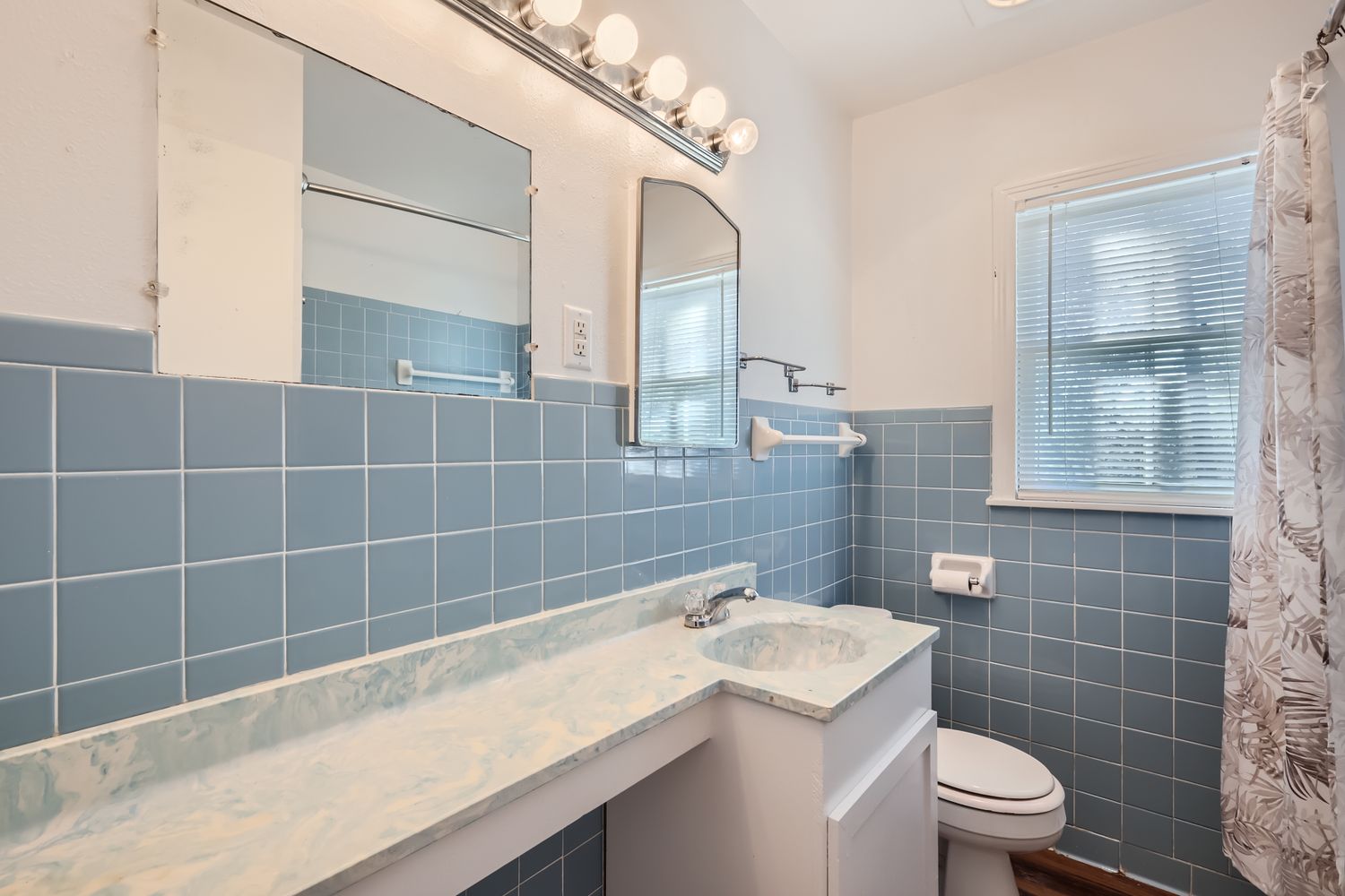7348 Highway 183 Lockhart, TX 78644 - Photo 6 of 13 Full bathroom with vanity, plenty of natural light, curtained shower, wainscoting, and tile walls