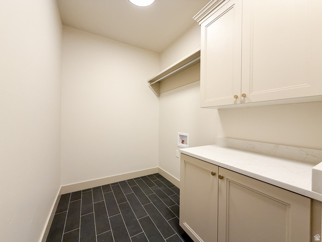 533 West S Temple Street, Unit 309 Tooele, UT 84074 - Photo 10 of 24 Laundry area with washer hookup and cabinet space