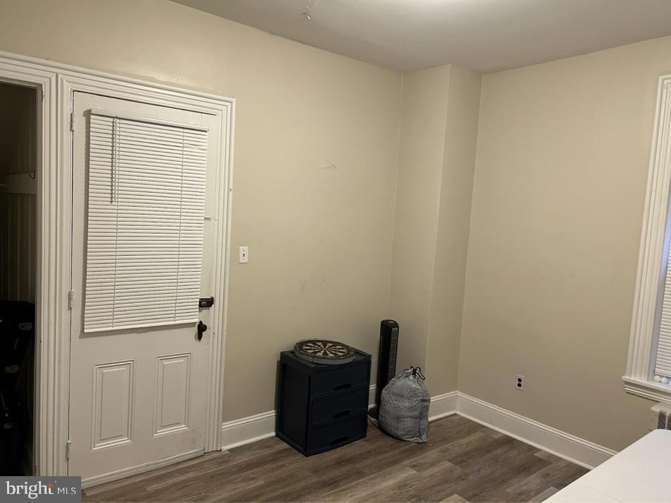 208 West Gay Street, Unit 2 West Chester, PA 19380 - Photo 5 of 12 a room with a bench and wooden floor