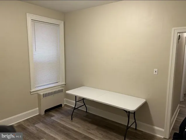 a small room with a table and a window
