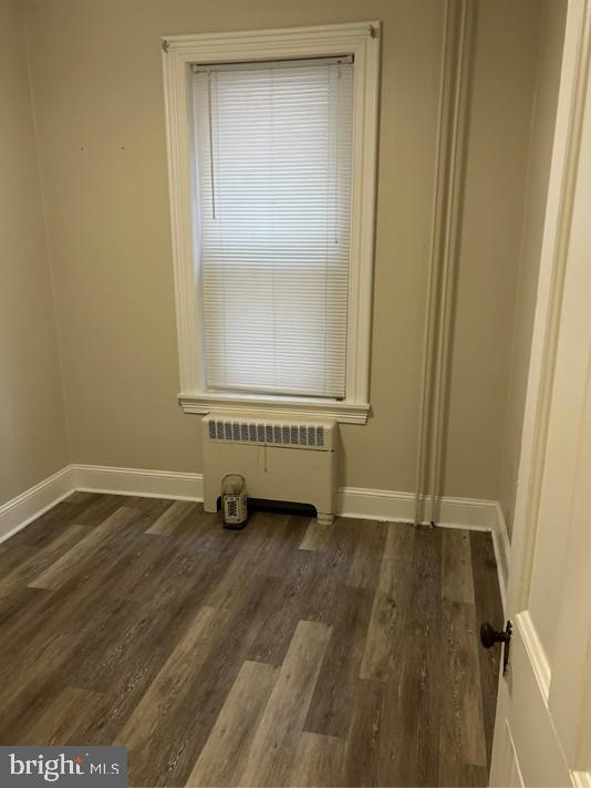 208 West Gay Street, Unit 2 West Chester, PA 19380 - Photo 7 of 12 a view of an empty room with wooden floor and a window