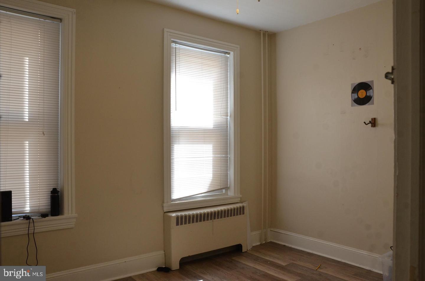208 West Gay Street, Unit 2 West Chester, PA 19380 - Photo 9 of 12 a view of an empty room with wooden floor and a window