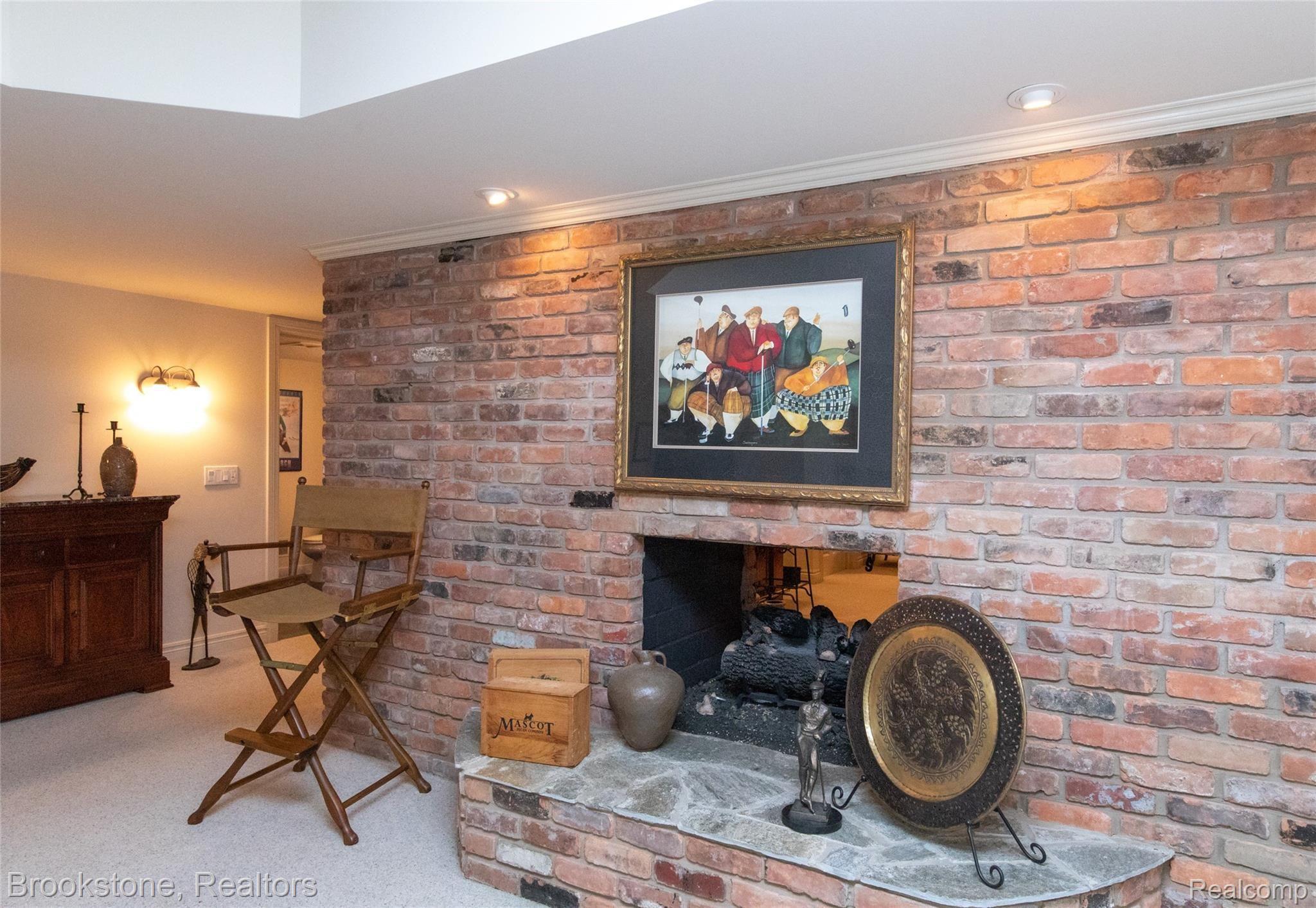 7608 Devins Ridge Clarkston, MI 48348 - Photo 40 of 42 Two Sided Masonry Gas Fireplace