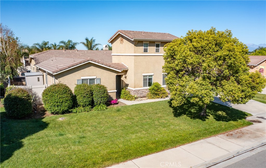 7840 La Cresta Street Highland, CA 92346 - Photo 2 of 47 a view of a house with a yard