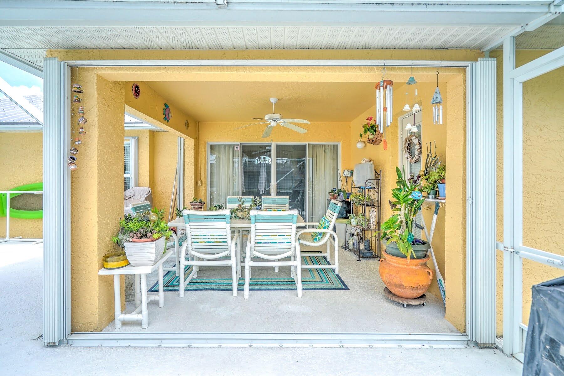 1829 Southwest Hickock Terrace Port St. Lucie, FL 34953 - Photo 15 of 62 a view of a dining room with a table and chairs