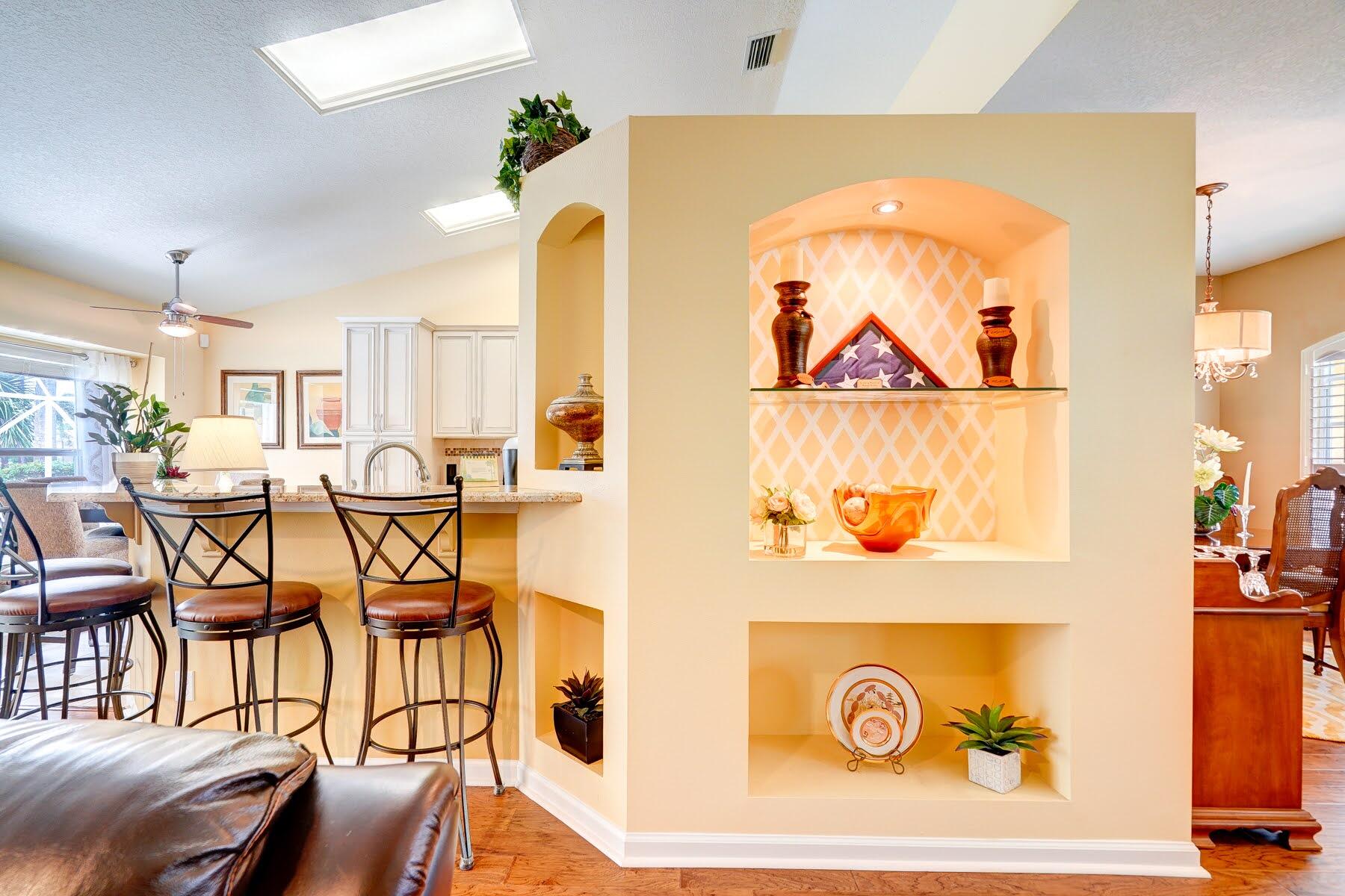 1829 Southwest Hickock Terrace Port St. Lucie, FL 34953 - Photo 30 of 62 a view of a dining room with furniture and a chandelier