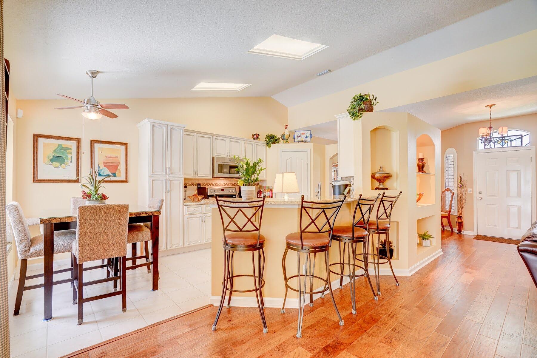 1829 Southwest Hickock Terrace Port St. Lucie, FL 34953 - Photo 32 of 62 a dining room with furniture and wooden floor