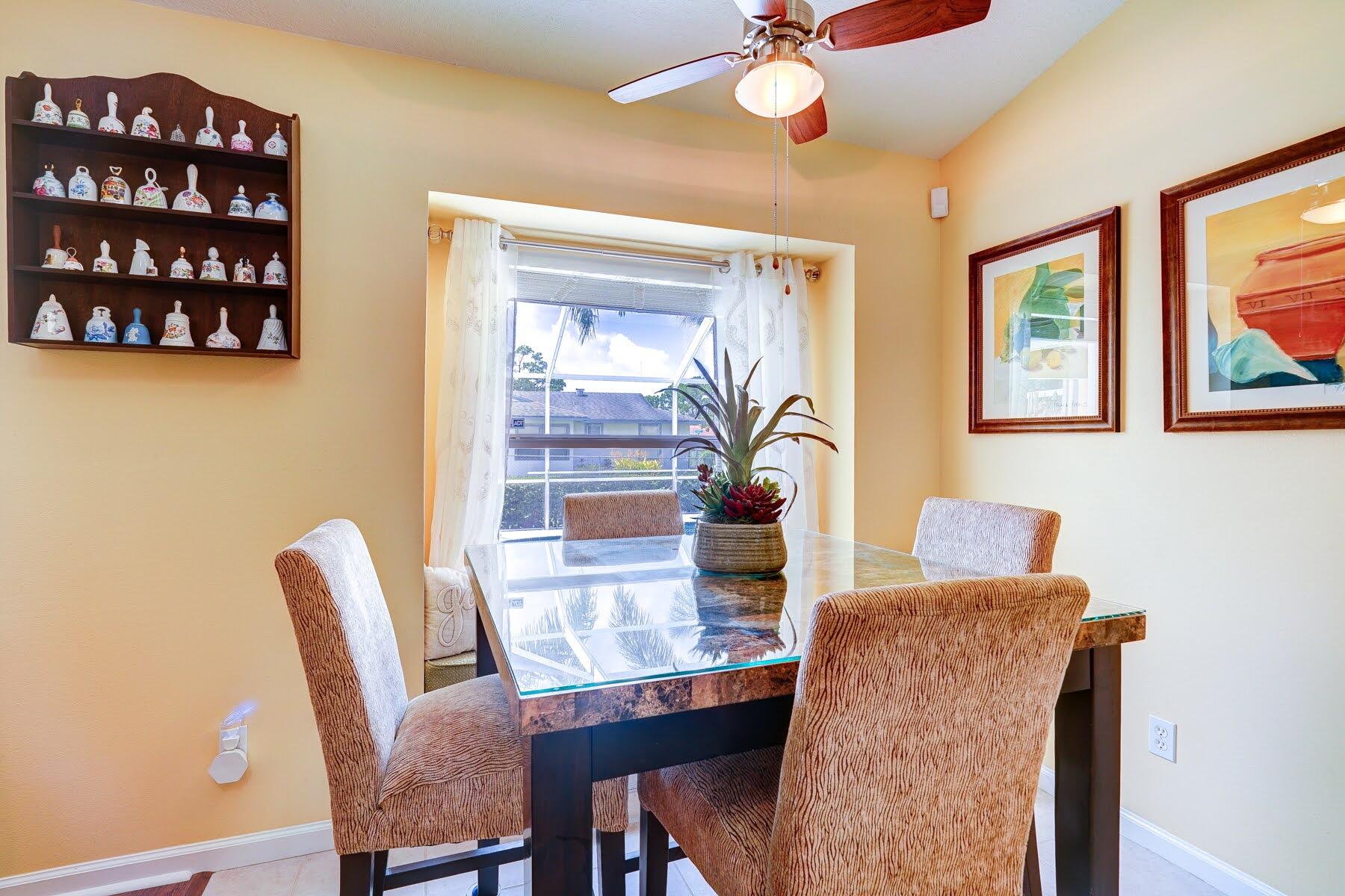 1829 Southwest Hickock Terrace Port St. Lucie, FL 34953 - Photo 33 of 62 a dining room with furniture and window