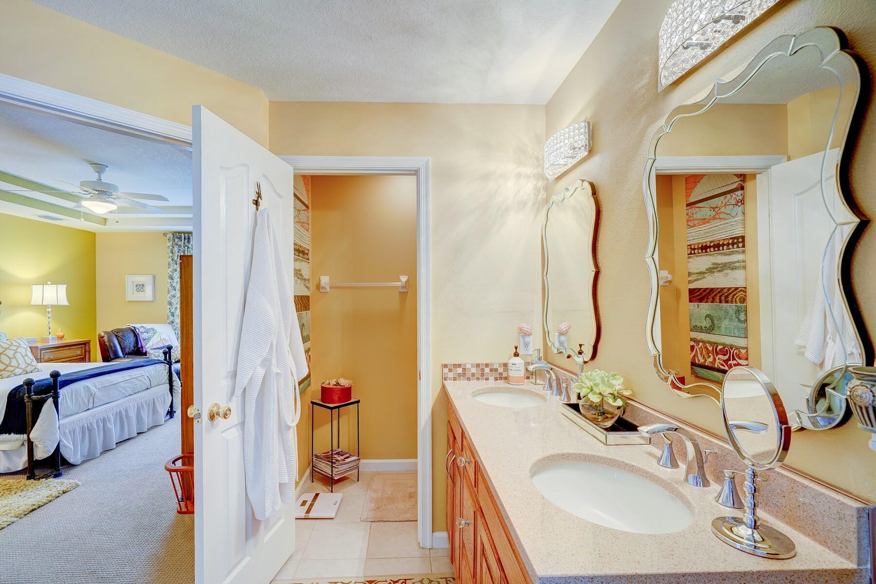 1829 Southwest Hickock Terrace Port St. Lucie, FL 34953 - Photo 43 of 62 a bathroom with a sink and a mirror
