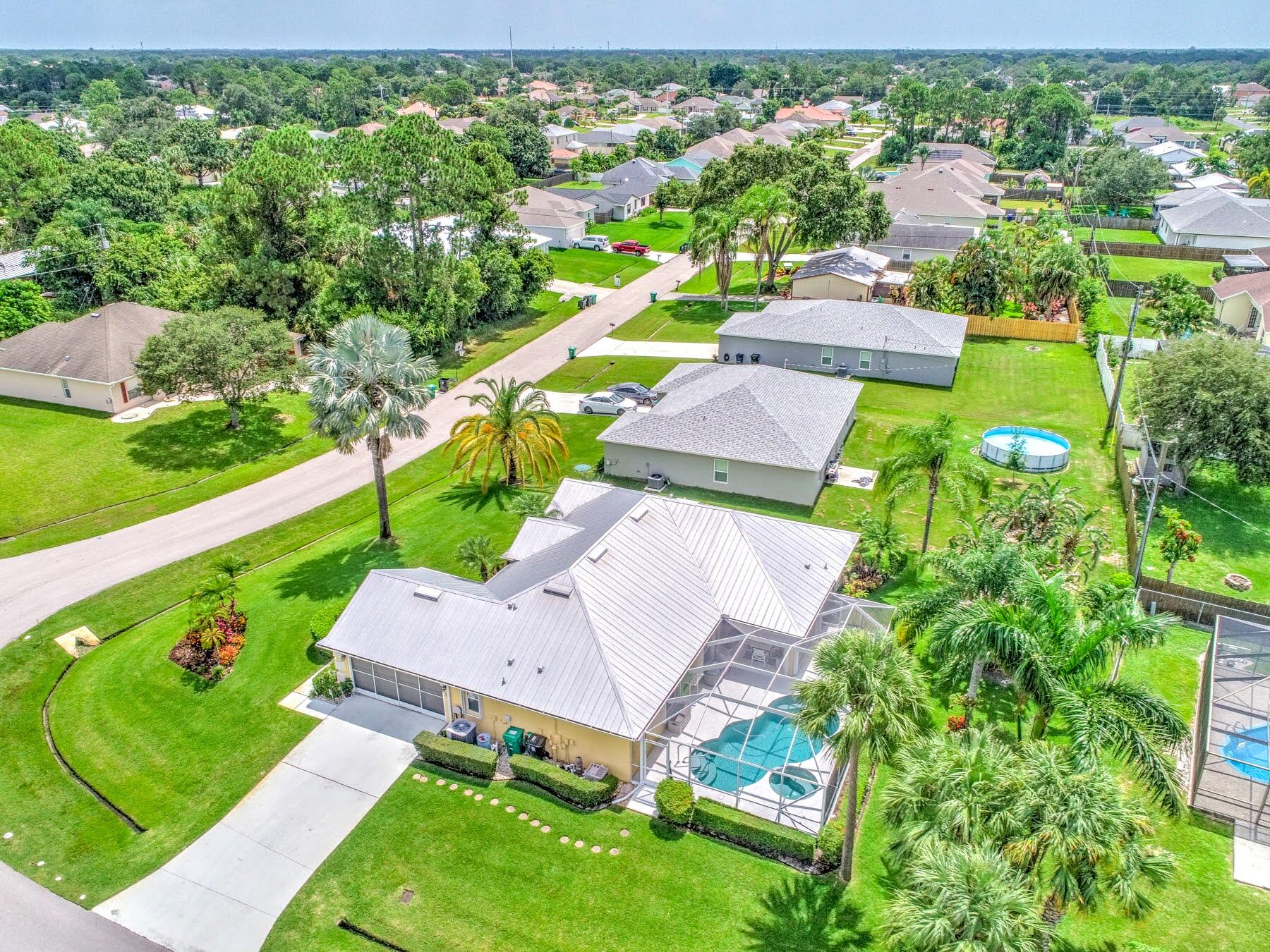 1829 Southwest Hickock Terrace Port St. Lucie, FL 34953 - Photo 60 of 62 an aerial view of a house with a garden