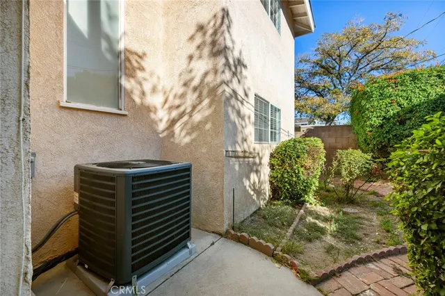 a view of a bench in the backyard