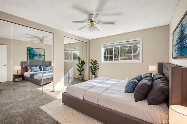 a bedroom with a bed and a couch