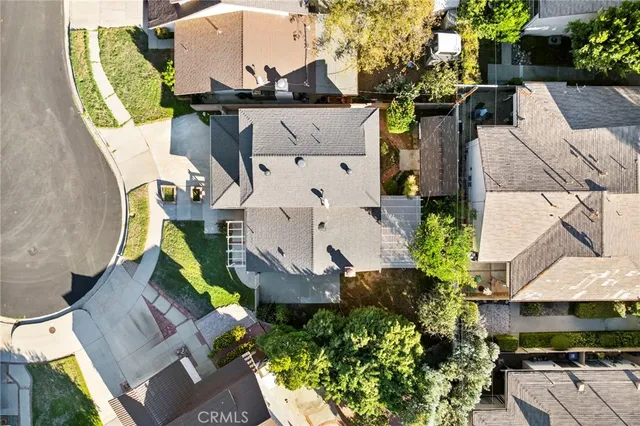 an aerial view of a house with outdoor space