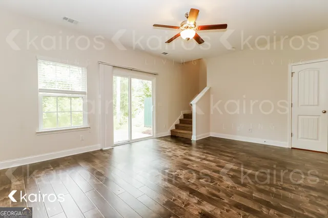 wooden floor in an empty room with a window