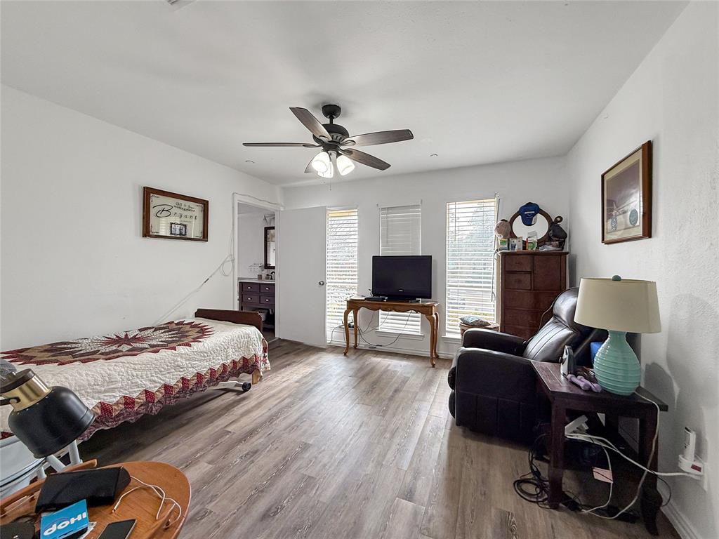 3109 Robin Road Plano, TX 75075 - Photo 12 of 34 a bedroom with bed tv and window