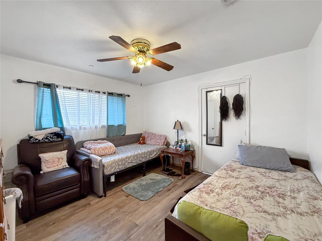 3109 Robin Road Plano, TX 75075 - Photo 14 of 34 a bedroom with bed and a couch