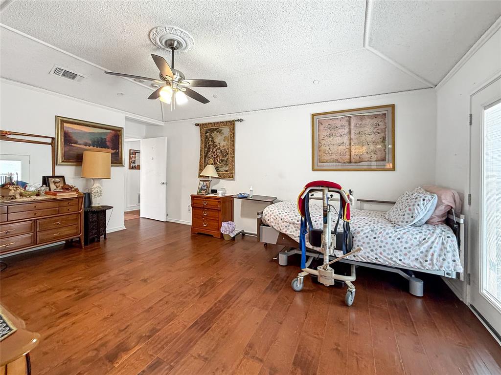 3109 Robin Road Plano, TX 75075 - Photo 20 of 34 a living room with furniture and a gym machine