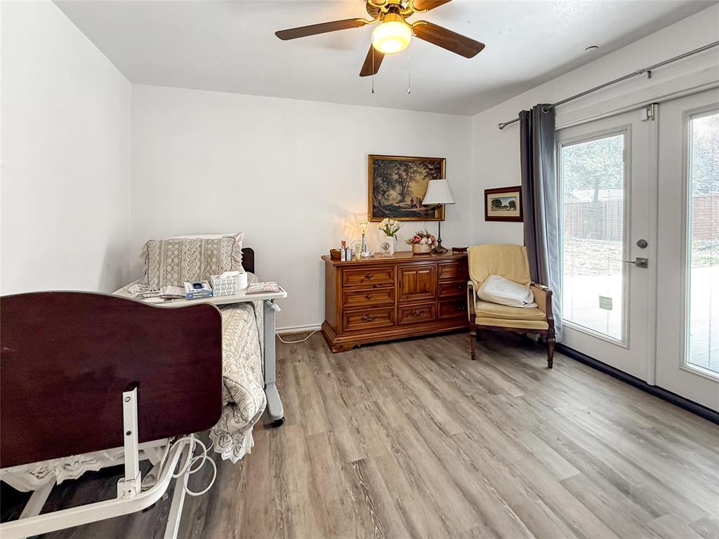 3109 Robin Road Plano, TX 75075 - Photo 24 of 34 a living room with furniture and wooden floor