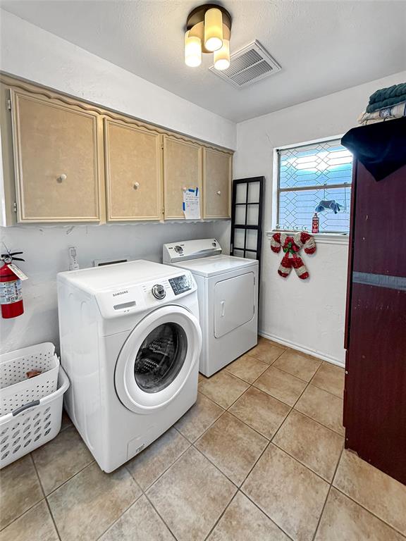 3109 Robin Road Plano, TX 75075 - Photo 26 of 34 a utility room with dryer and washer