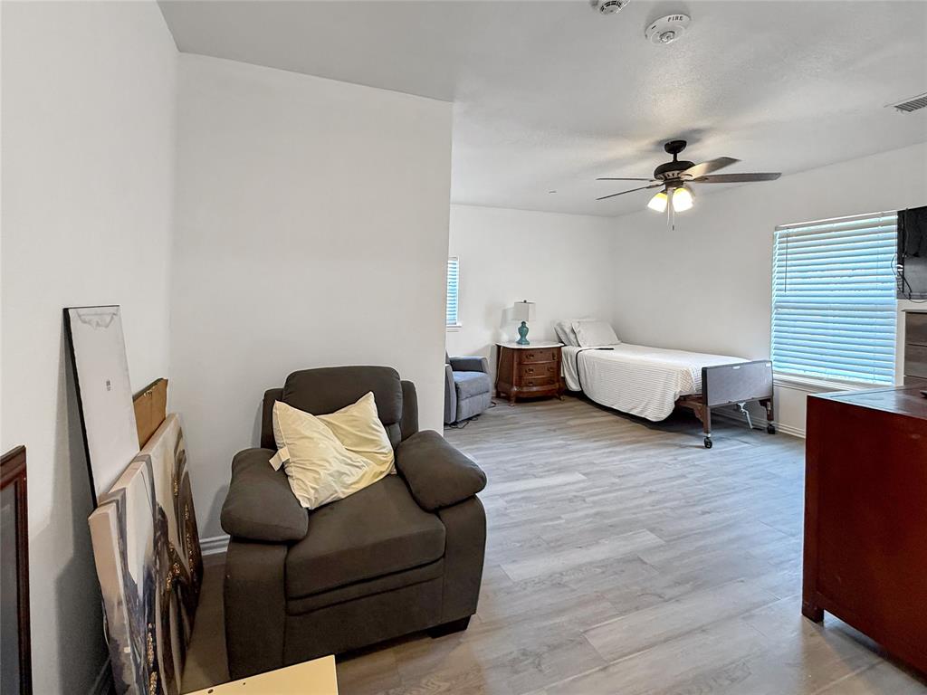3109 Robin Road Plano, TX 75075 - Photo 27 of 34 a living room with furniture and a lamp