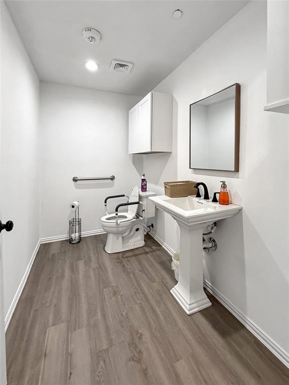 3109 Robin Road Plano, TX 75075 - Photo 28 of 34 a living room with furniture and a wooden floor