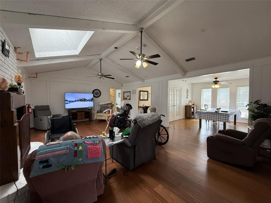 3109 Robin Road Plano, TX 75075 - Photo 5 of 34 a living room with lots of furniture and a wooden floor