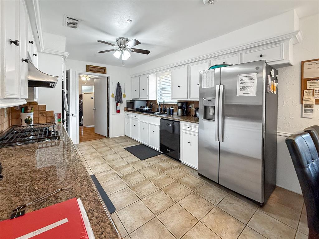 3109 Robin Road Plano, TX 75075 - Photo 7 of 34 a kitchen with stainless steel appliances granite countertop a refrigerator a stove and a sink