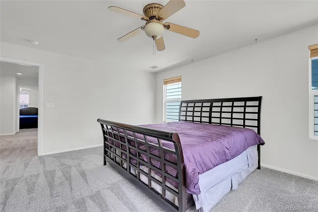 a bathroom with a sink toilet and a mirror