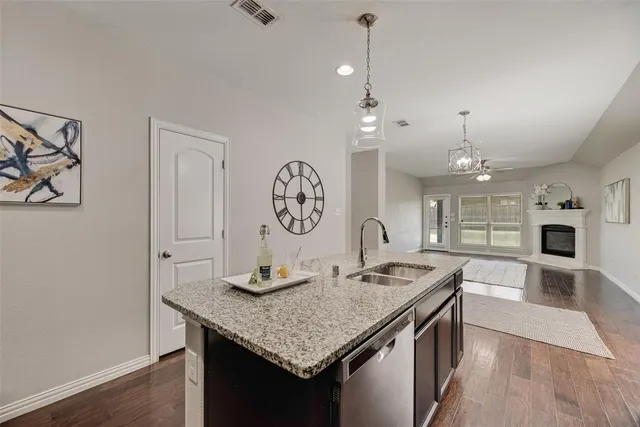 a kitchen with a table chairs and a fireplace