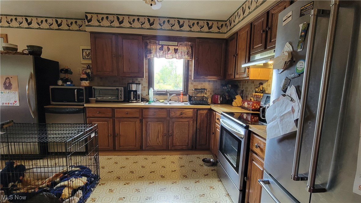 4133 Beat Road Litchfield, OH 44253 - Photo 12 of 25 Kitchen with sink and stainless steel appliances