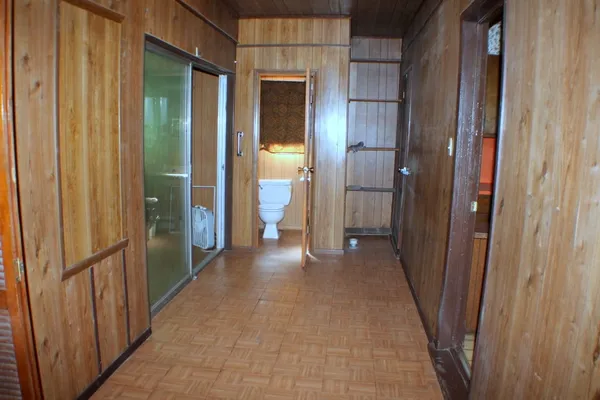 a bathroom with a toilet a sink and a mirror