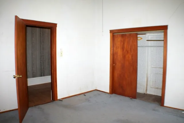 an empty room with fan