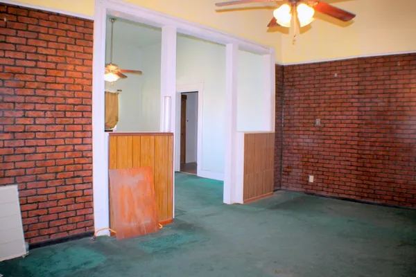 a kitchen with a stove and a refrigerator