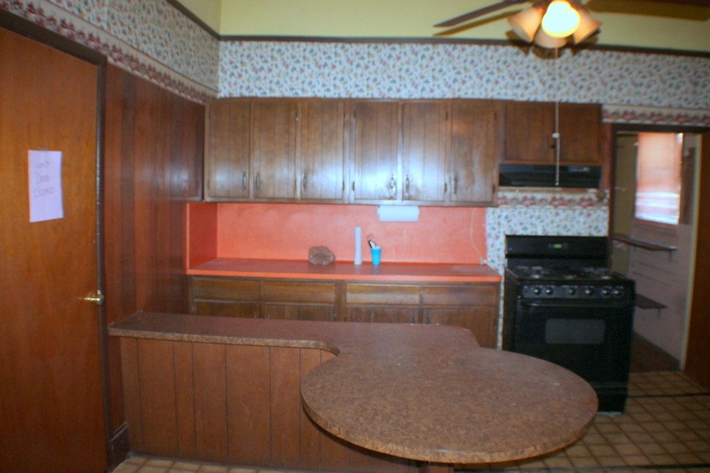 2602 Saltus Street Houston, TX 77003 - Photo 9 of 22 a kitchen with a stove and a refrigerator