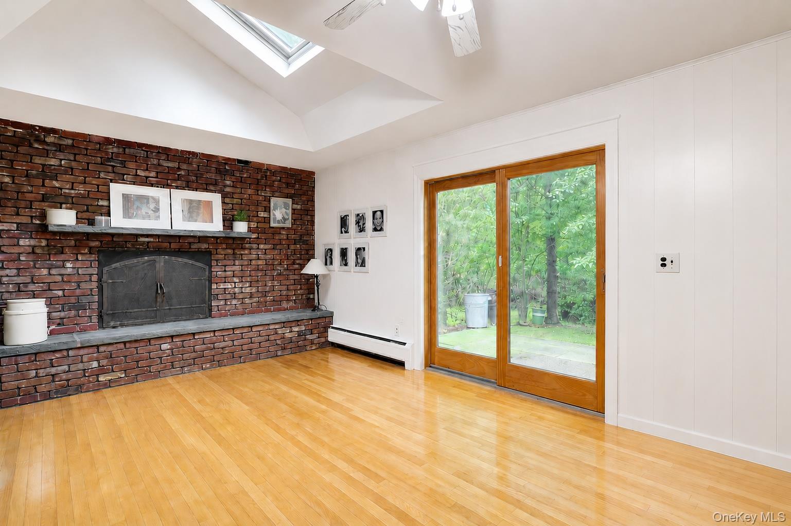 8 Swallow Avenue Spring Valley, NY 10977 - Photo 10 of 28 a view of an empty room with a fireplace and a window
