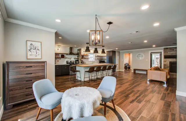 a view of a dining room with furniture and wooden floor