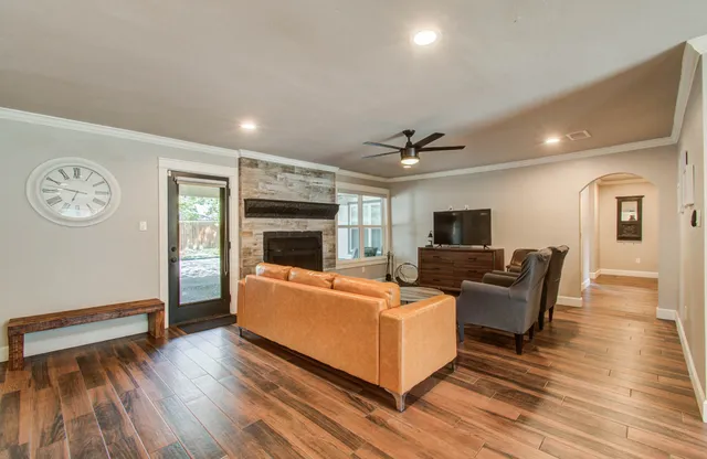 a living room with furniture and a fireplace