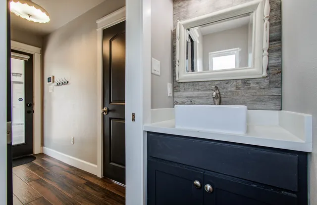 a bathroom with a sink and a mirror